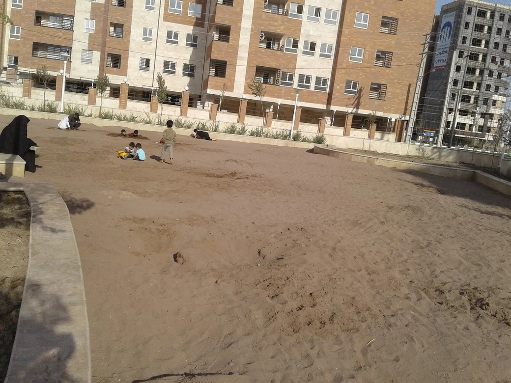 Children playing in the large sandpit at Koodak Park