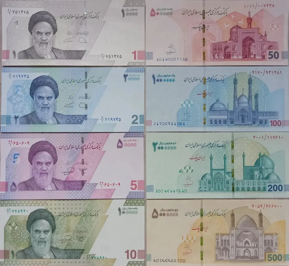 The full set of Iranian rial banknotes laid out in two columns — the 1, 2, 5 and 10 ten-thousand-rial notes bearing the portrait of Imam Khomeini on the left, and the 50, 100, 200 and 500 Iran Cheques showing shrine architecture on the right