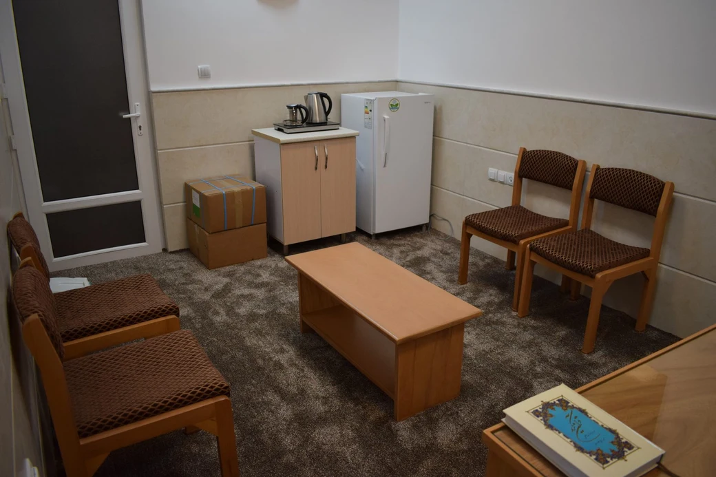 The SIOS student kitchenette, with a kettle, small fridge, cabinet and chairs around a low table